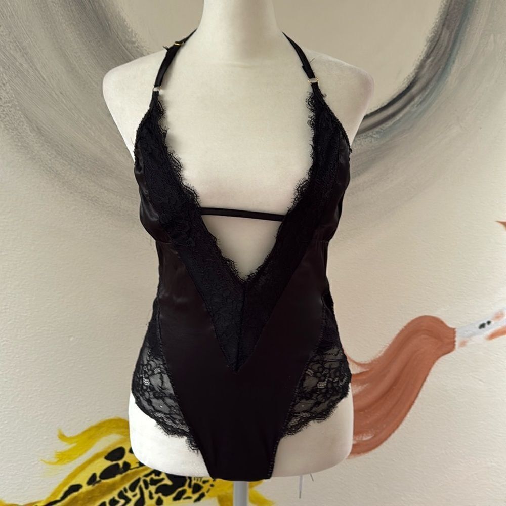 Forever 21 lingerie body suit. Size small. Silky black lace. Snaps at bottom.